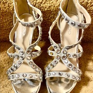 Silver, platform, dressy 5” high heels by Aldo Size 9.